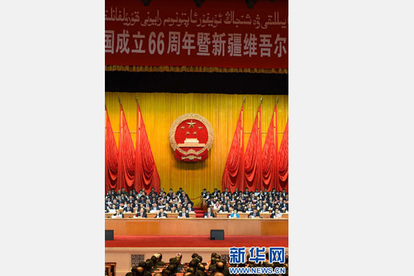 10月1日，慶祝中華人民共和國(guó)成立66周年暨新疆維吾爾自治區(qū)成立60周年大會(huì)在新疆人民會(huì)堂隆重舉行。 新華社記者 高潔 攝 